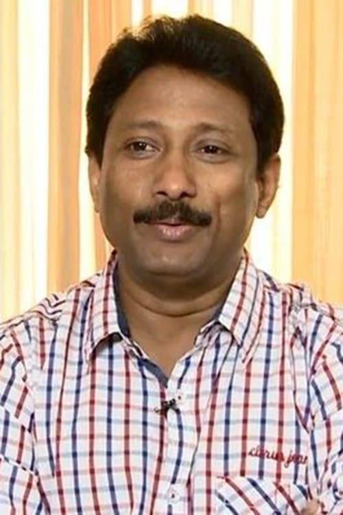 A portrait of Akku Akbar