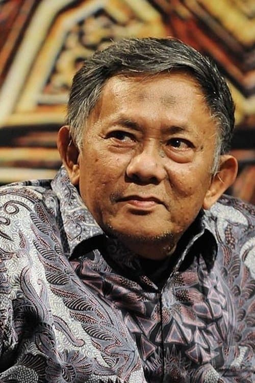 A portrait of Chaerul Umam