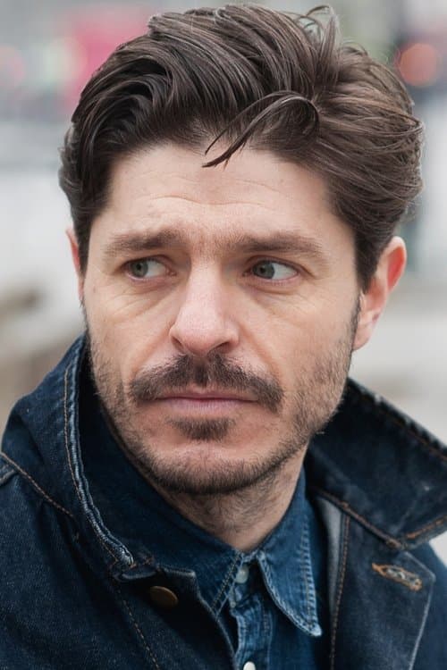 A portrait of Damián John Harper
