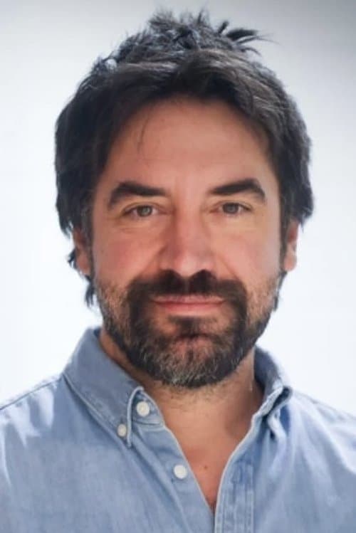 A portrait of Dominic James