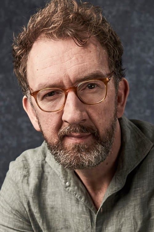 A portrait of John Carney