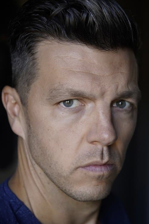 A portrait of Justin G. Dyck