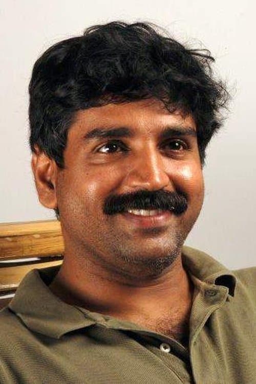 A portrait of Kukku Surendran