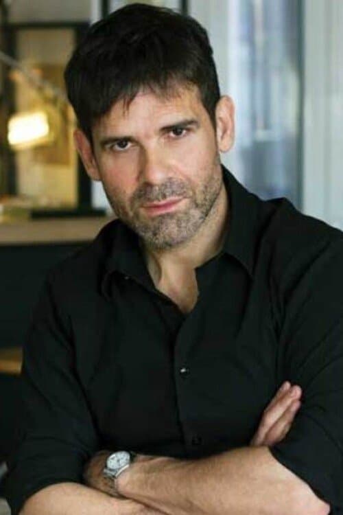 A portrait of Menelaos Karamaghiolis