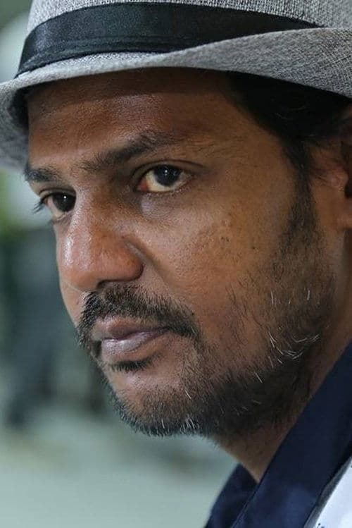 A portrait of Tamilvannan