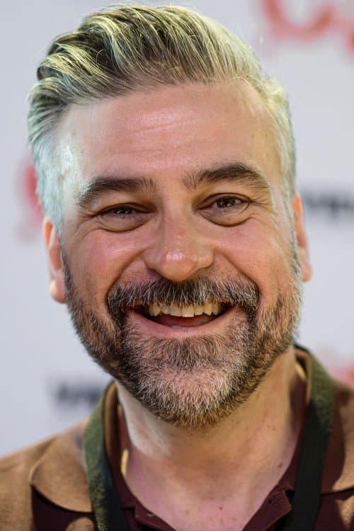 A portrait of Troy Quane