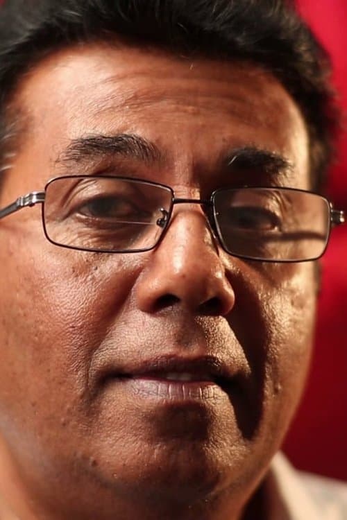 A portrait of Udayakantha Warnasuriya